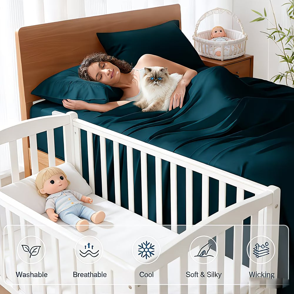 Woman lying in bed with a cat, surrounded by teal bedding, next to a crib with a baby doll.