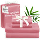 Pink ice cooling bamboo bed sheets set with a tag and green leaves on a white background