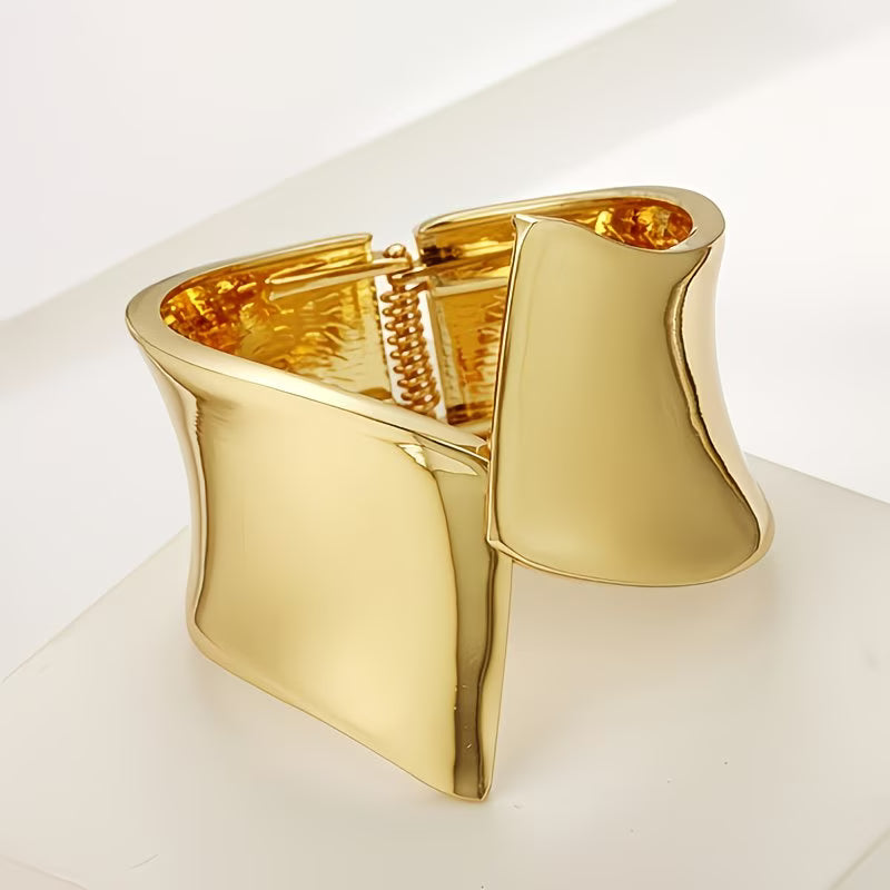Gold bracelet on a white background
