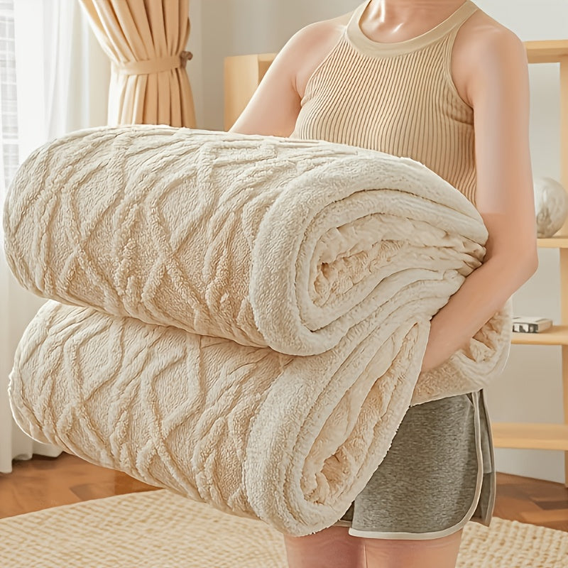 Person holding a large beige blanket in a home setting