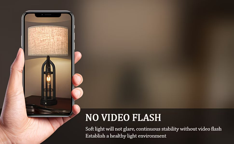 Hand holding a smartphone displaying a lamp with text about no video flash