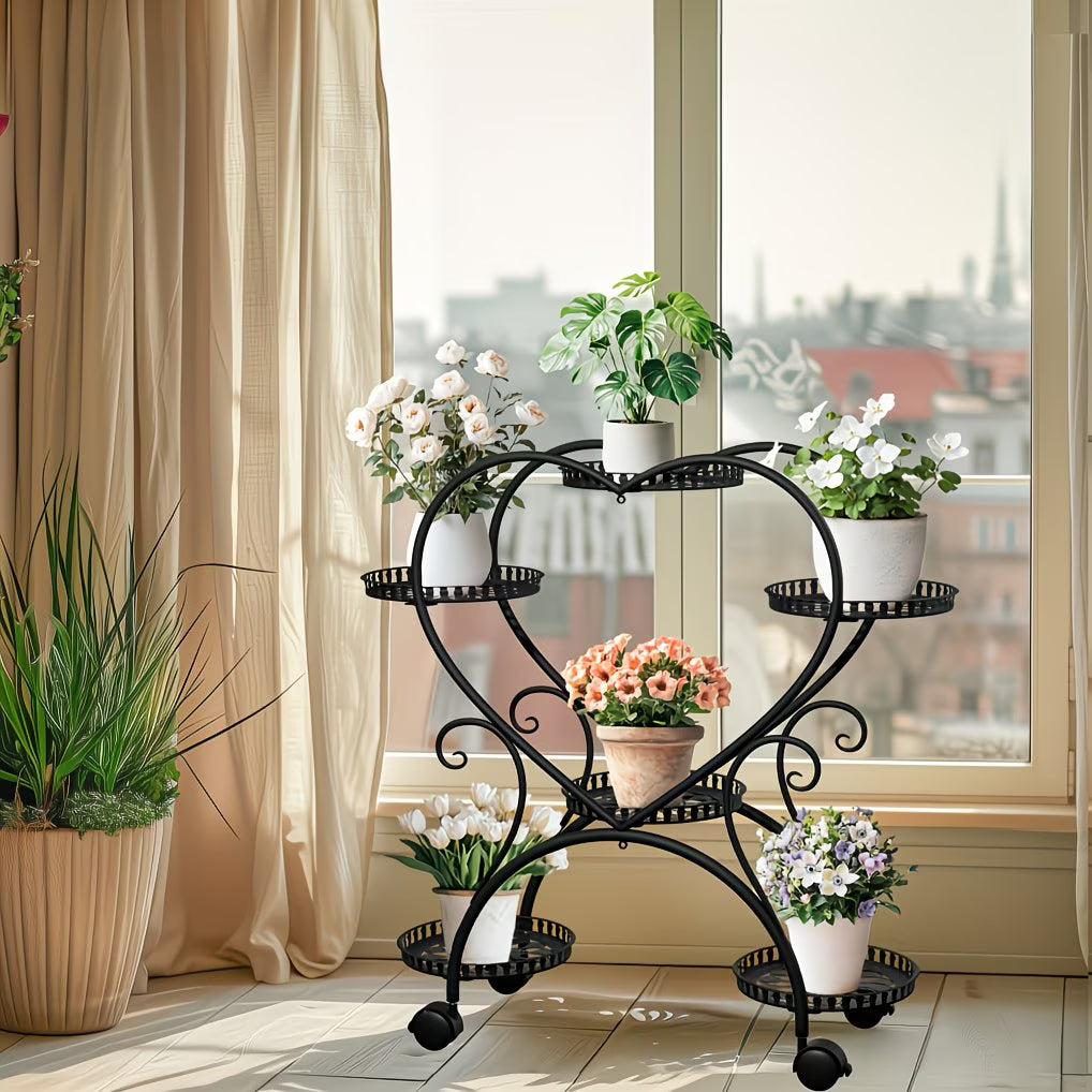 Decorative metal plant stand with potted plants in a bright room.