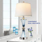 Table lamp with dual USB ports on a white surface, near a smartphone and smartphone case.