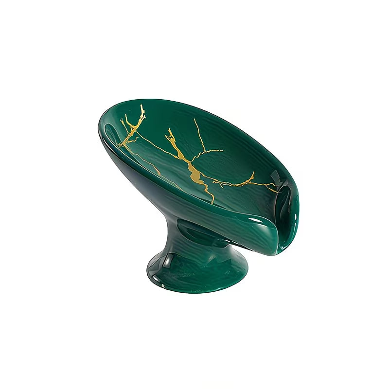Green ceramic vase with gold accents on a white background