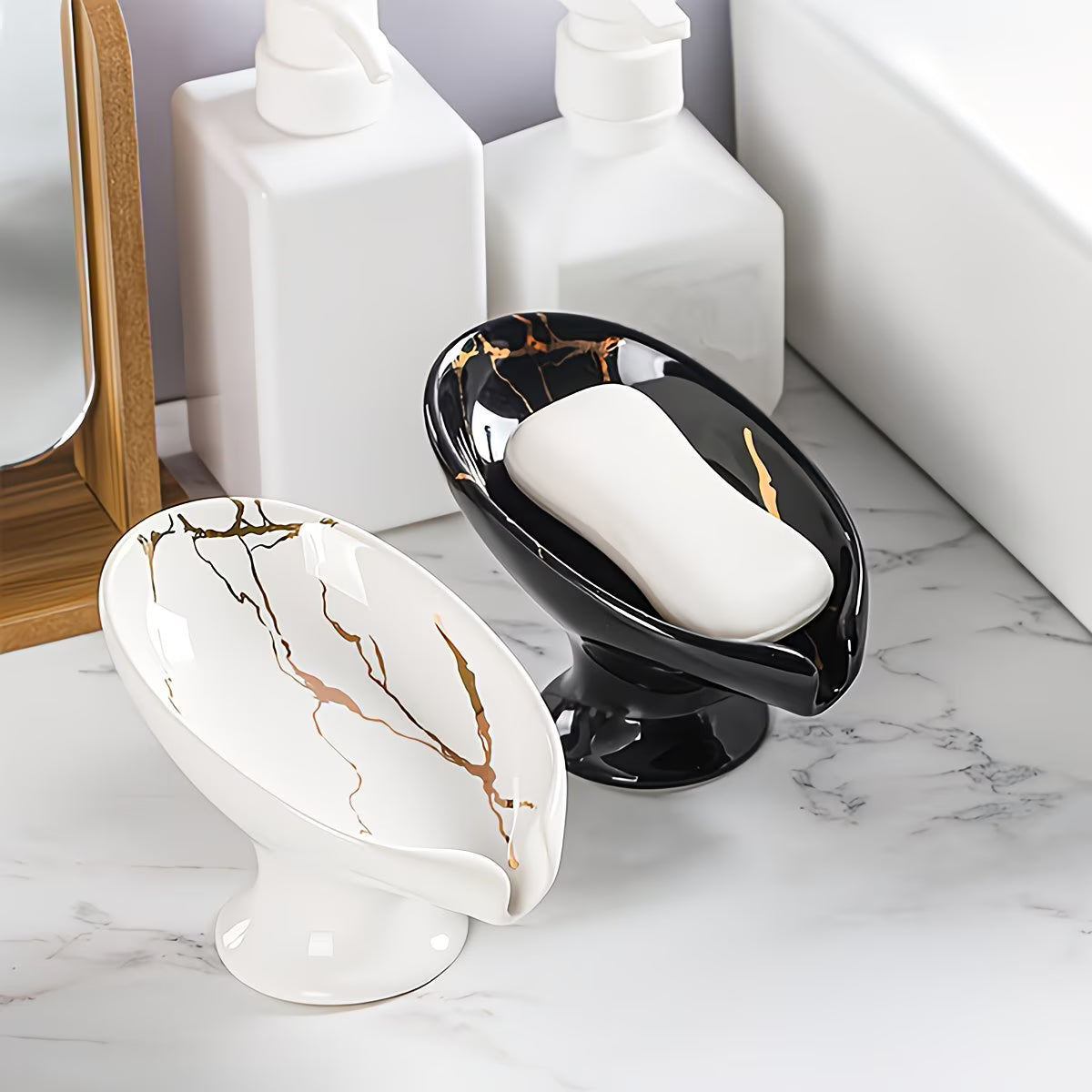 Two marble-patterned soap dishes with soap on a bathroom counter.