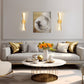 Modern living room with a gray sofa, decorative pillows, a coffee table, and wall art.