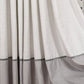 Close-up of a gray curtain with a textured pattern