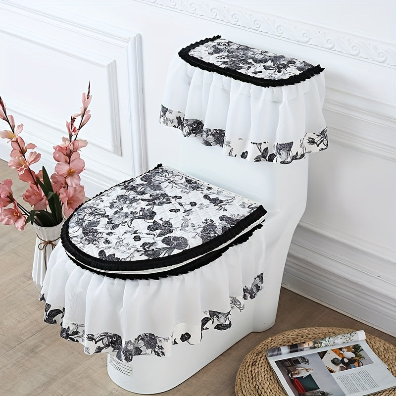 Toilet set with floral design and black trim on a white toilet against a decorative wall.