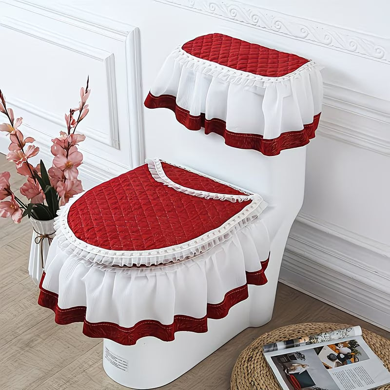 Red and white toilet seat cover set on a toilet against a decorative wall.