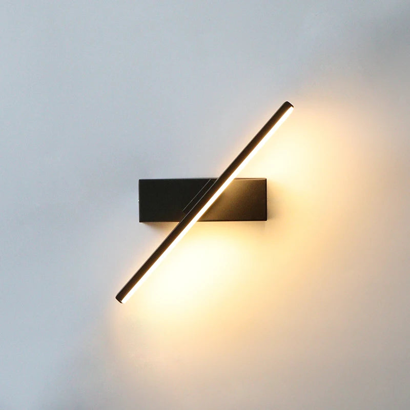 Modern wall-mounted light fixture on a plain wall