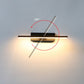 Modern wall-mounted light fixture with a 330-degree rotation feature on a plain wall.
