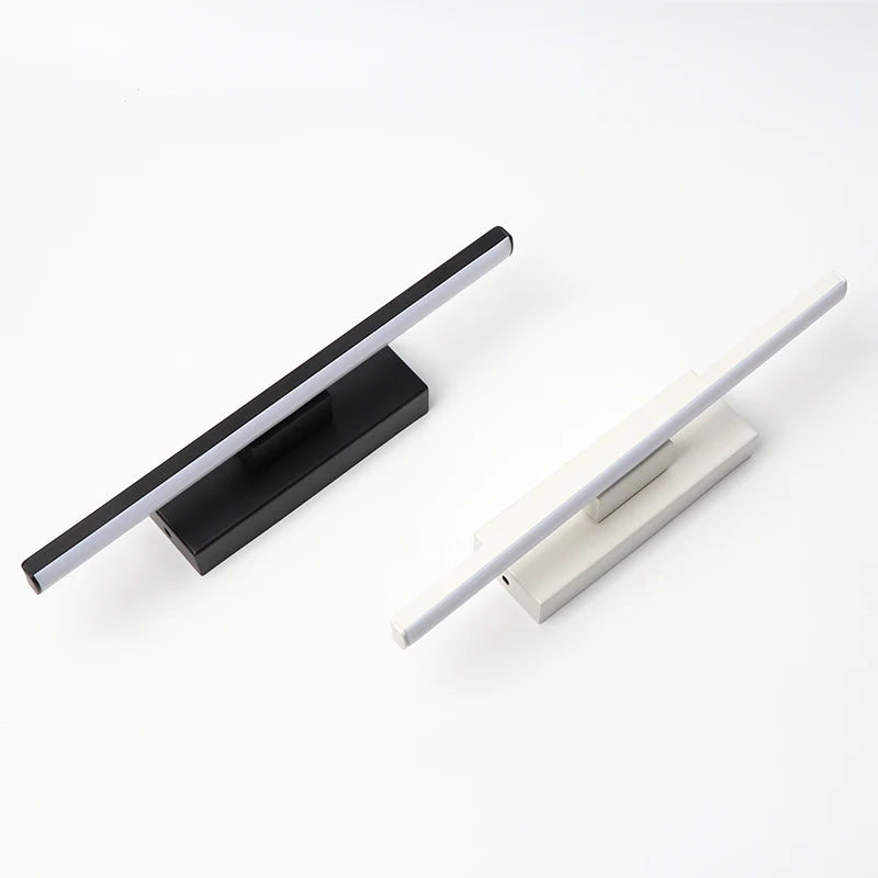 Two modern door handles, one black and one silver, on a white background.