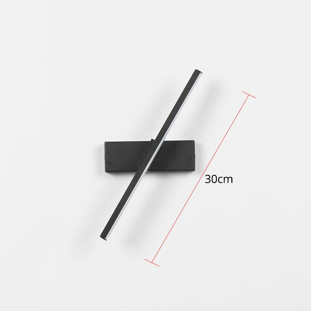 Black rectangular light fixture with a black rod on a white background, showing measurement details.
