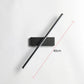Modern wall clock with a long black arm on a white background