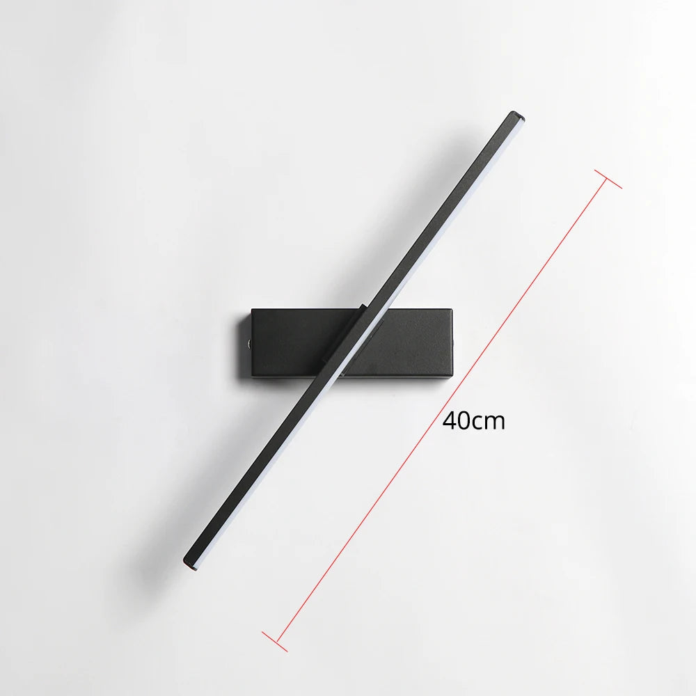 Modern wall clock with a long black arm on a white background