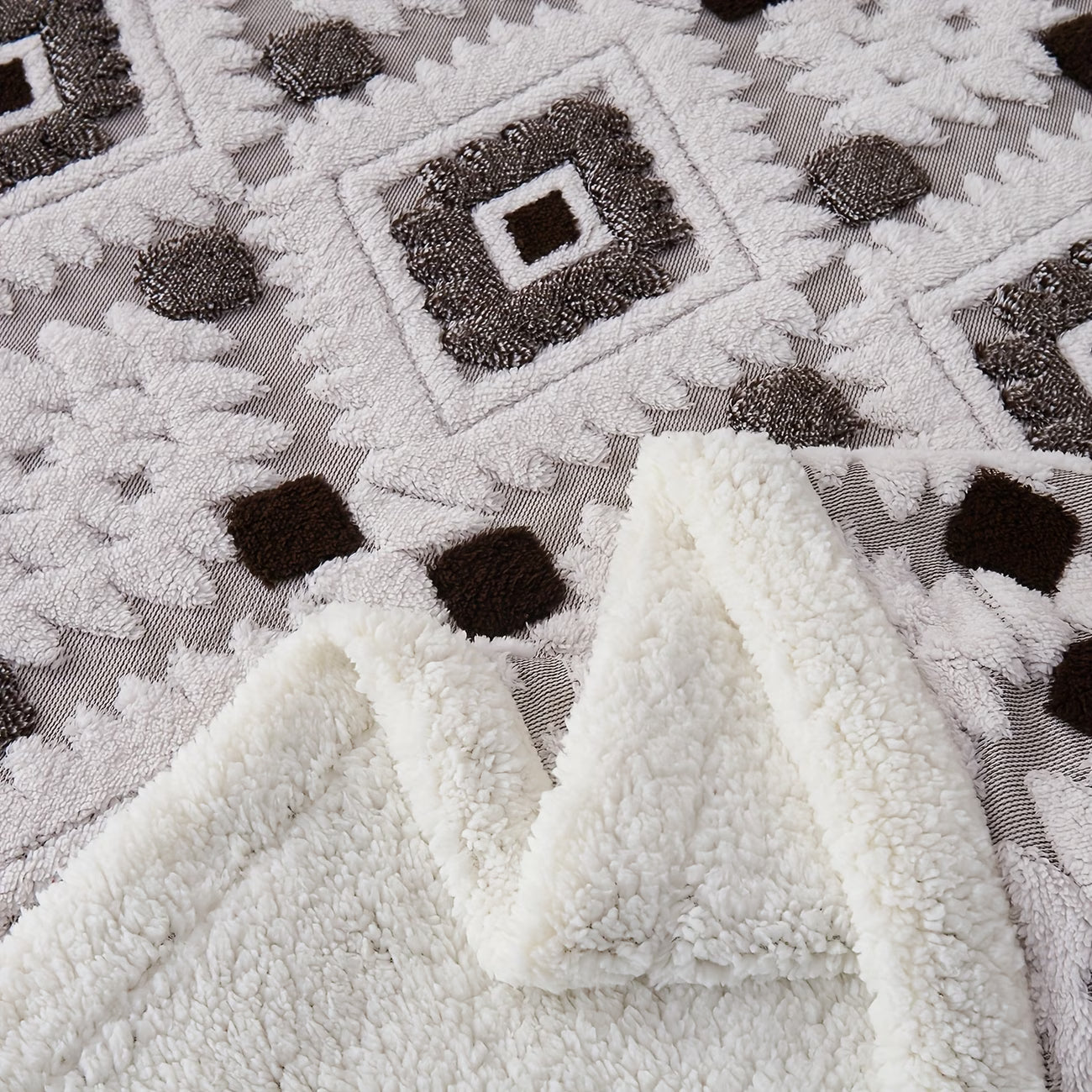 Close-up of textured white fabric with a patterned background