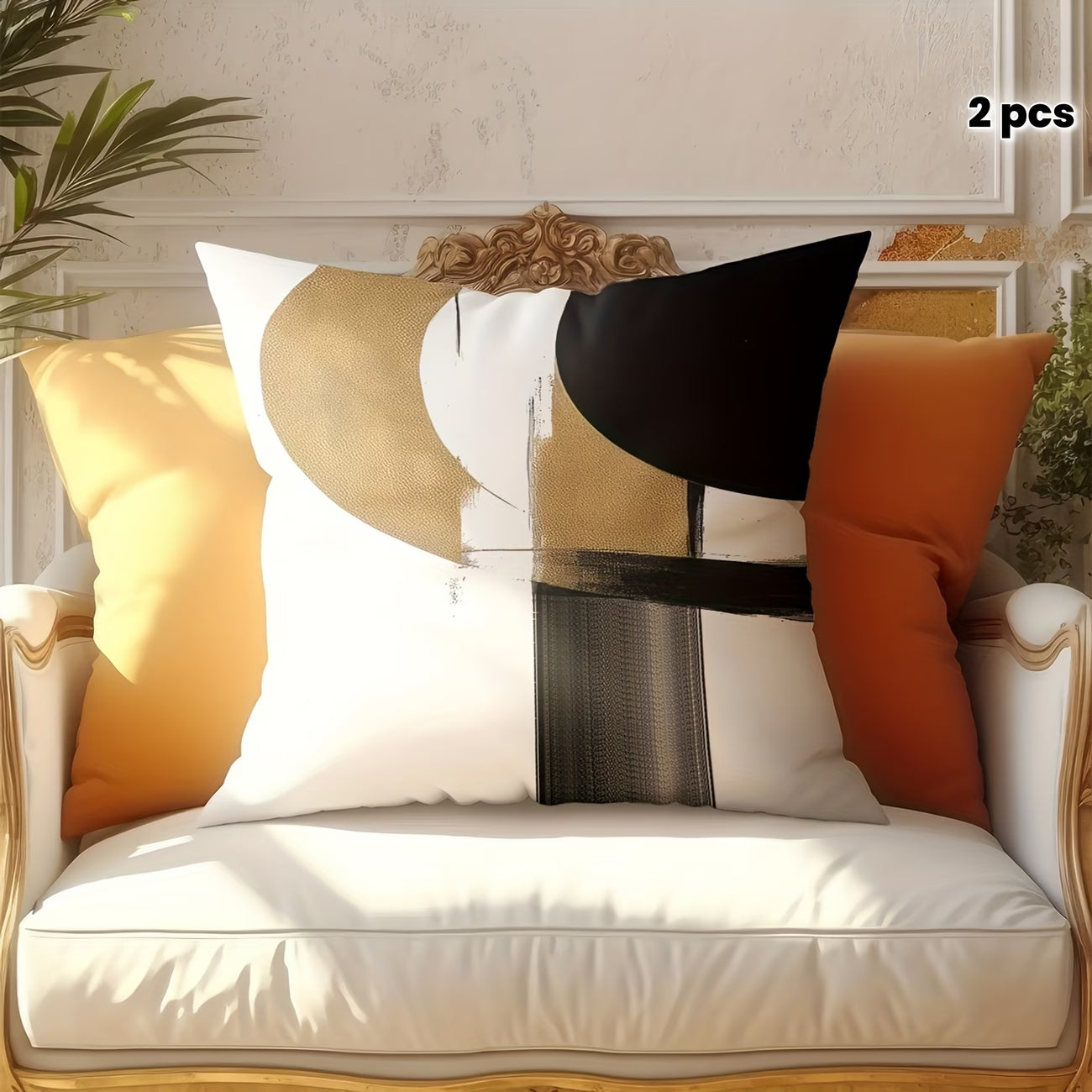 Decorative pillows with abstract patterns on a white cushioned chair.