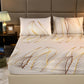 Bedding set with leaf pattern on a bed in a bedroom setting