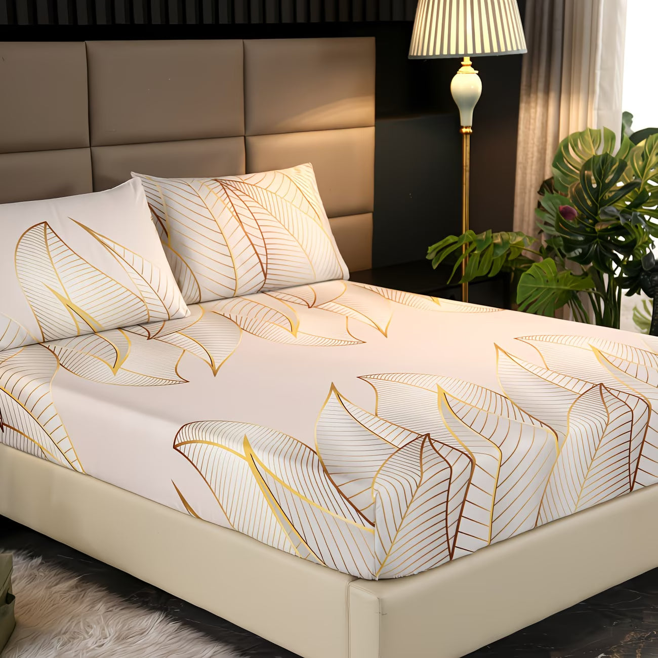 Bed with leaf-patterned bedding in a bedroom setting