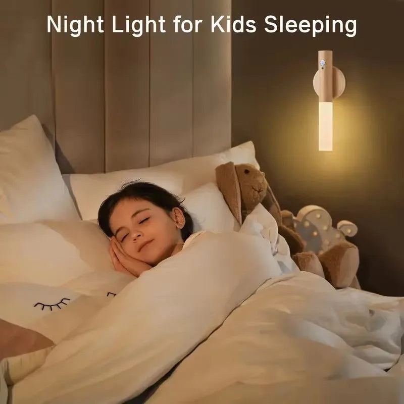 Child in bed with a night light on the wall above, promoting a cozy bedtime atmosphere.