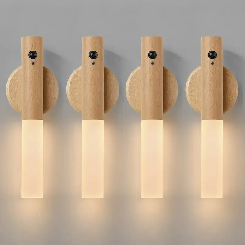 Four wooden wall lights with a warm glow on a gray background