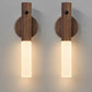 Two wooden wall sconces with cylindrical design on a gray background
