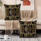 Decorative pillows with geometric patterns on a couch in a living room setting.
