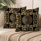 Decorative pillows with Greek key pattern on a couch