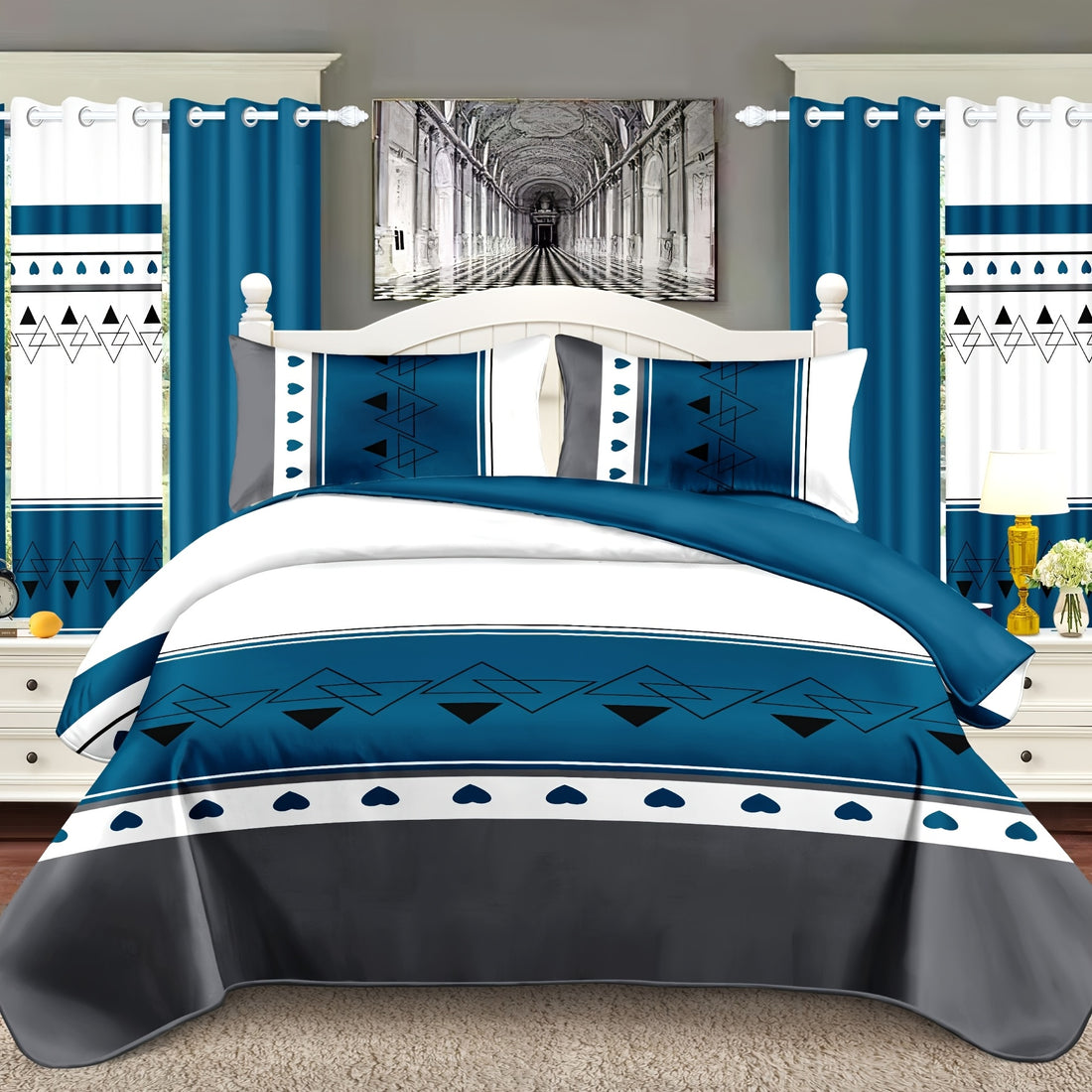 Blue and white bedding set on a bed with matching curtains and decor.