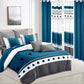 Bedroom with blue and gray bedding set and matching curtains.