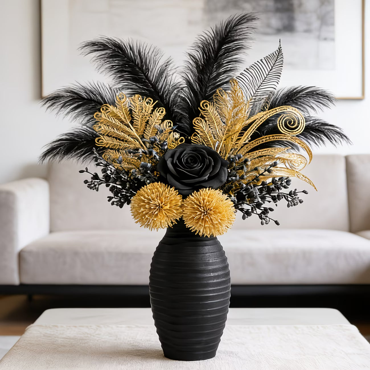 Decorative flower arrangement with black and gold flowers in a black vase on a table.