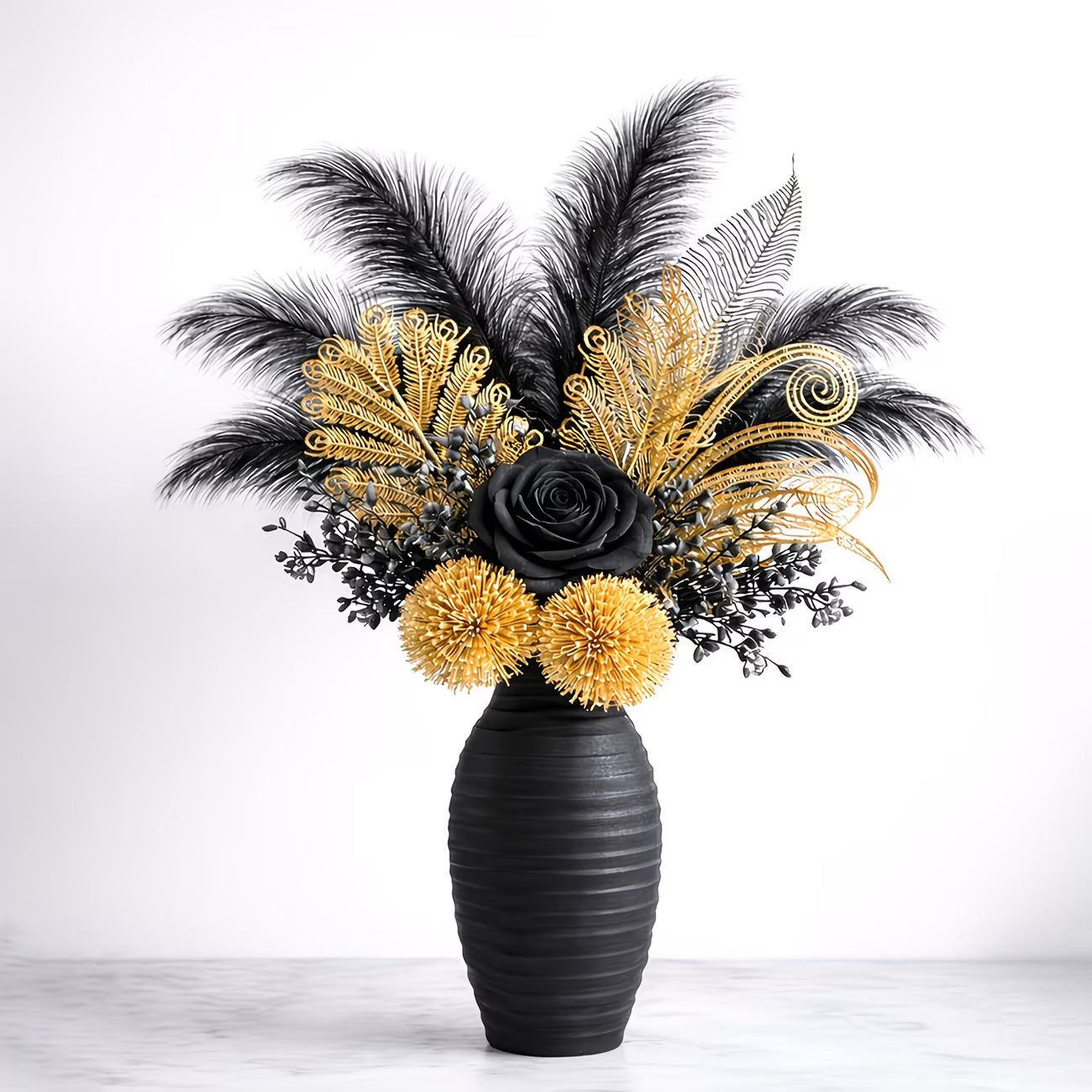 Decorative flower arrangement with black and gold flowers in a black vase on a white background