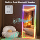 Smart mirror with built-in dual Bluetooth speaker in a room setting
