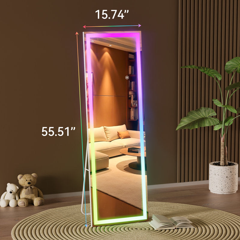 Full-length mirror with dimensions in a room with a sofa, plants, and toys.