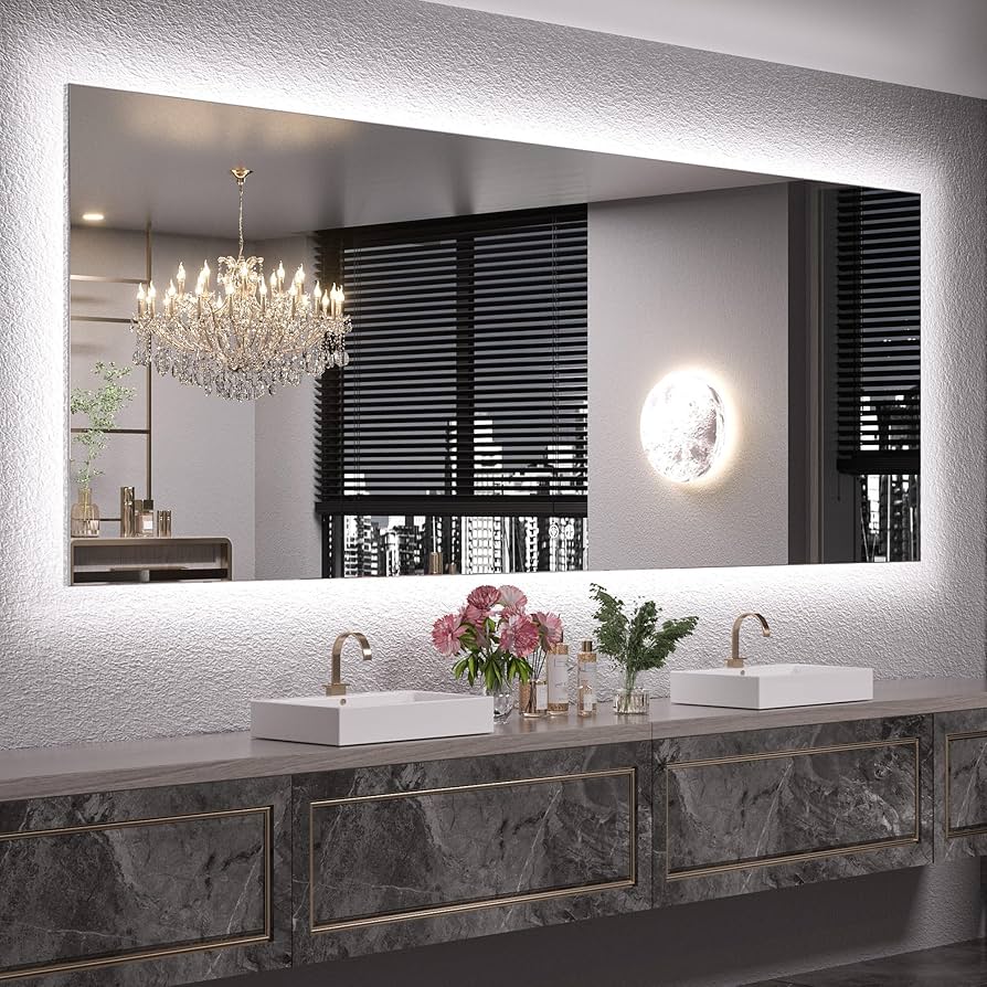 Bathroom vanity with large illuminated mirror, sinks, and decorative elements.