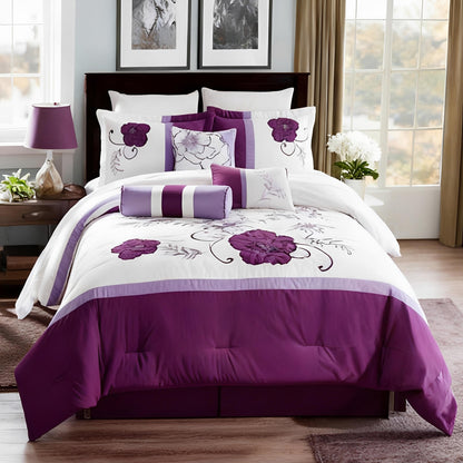Purple and white floral bedding set on a bed in a room with windows and decor.