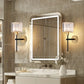 Bathroom vanity with illuminated mirror and wall lights