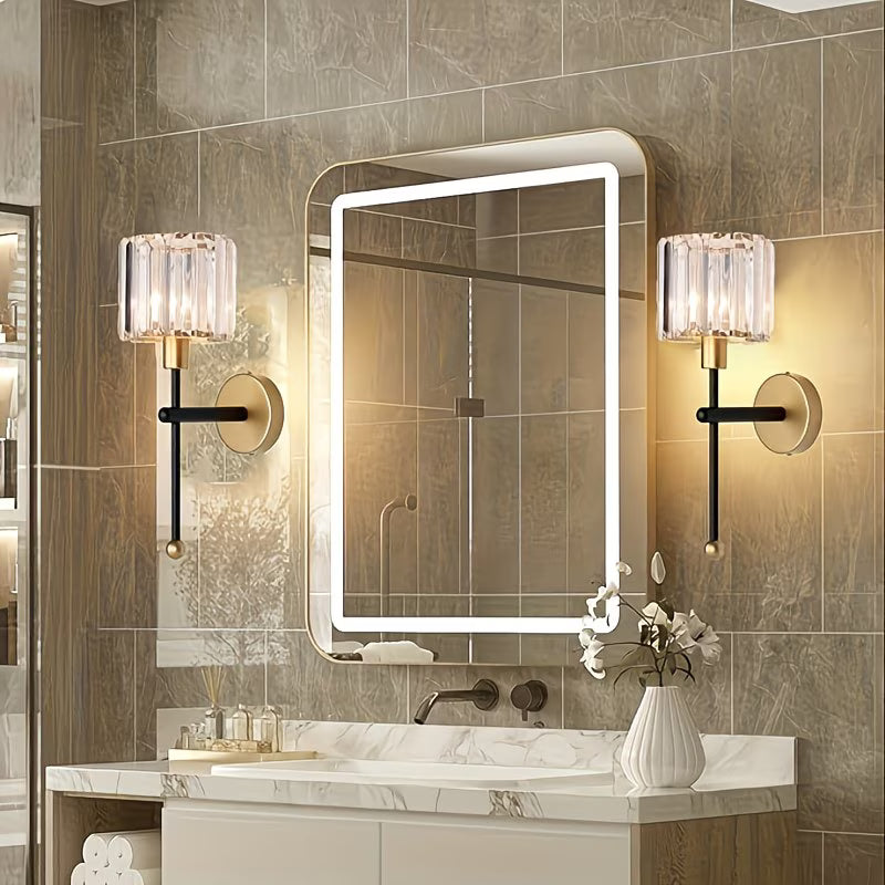 Bathroom vanity with illuminated mirror and wall lights