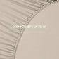 Beige fitted sheet with text 'DEEP POCKETS UP TO 16”' on a beige background