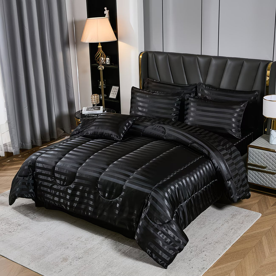Black textured bedding set on a bed in a bedroom with a lamp and curtains.