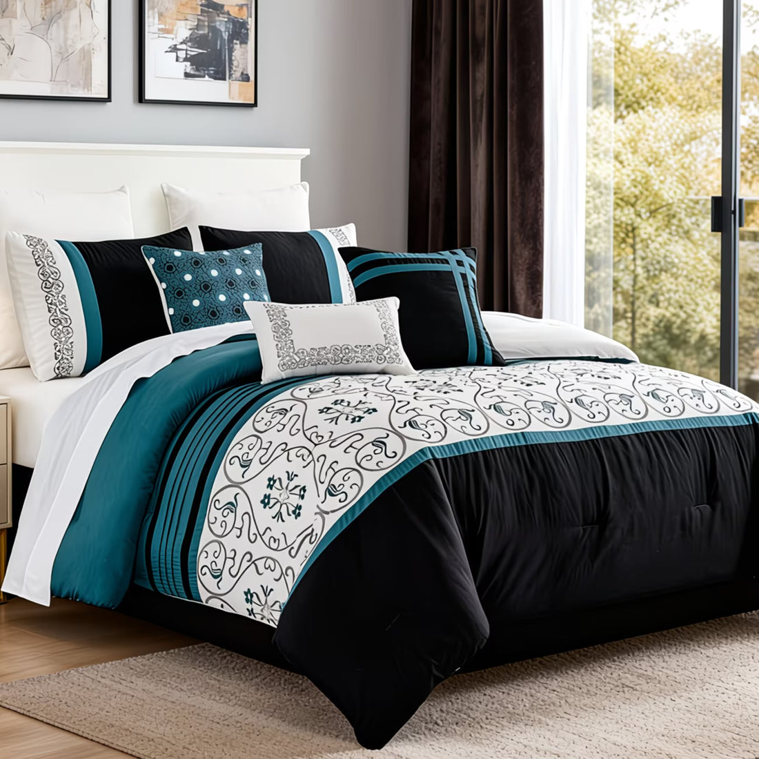 Bedroom with a bed featuring a black, white, and teal comforter.