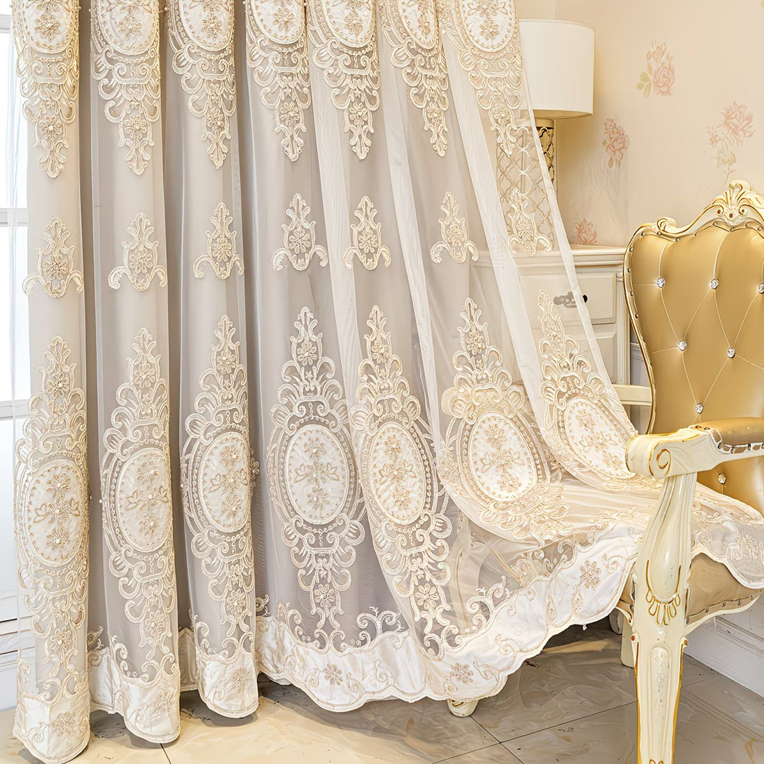 Decorative lace curtain with intricate patterns in a room with a gold chair.