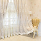 Decorative lace curtains with intricate patterns in a room with a gold chair.