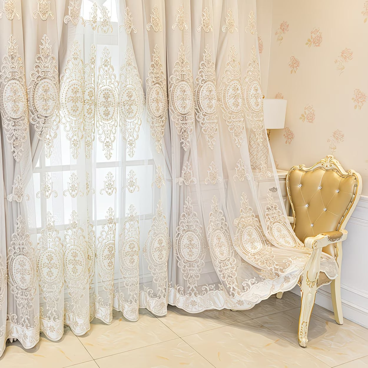 Decorative lace curtains with intricate patterns in a room with a gold chair.