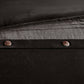 Close-up of a dark fabric surface with buttons
