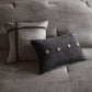 Two decorative pillows on a gray sofa with button details.