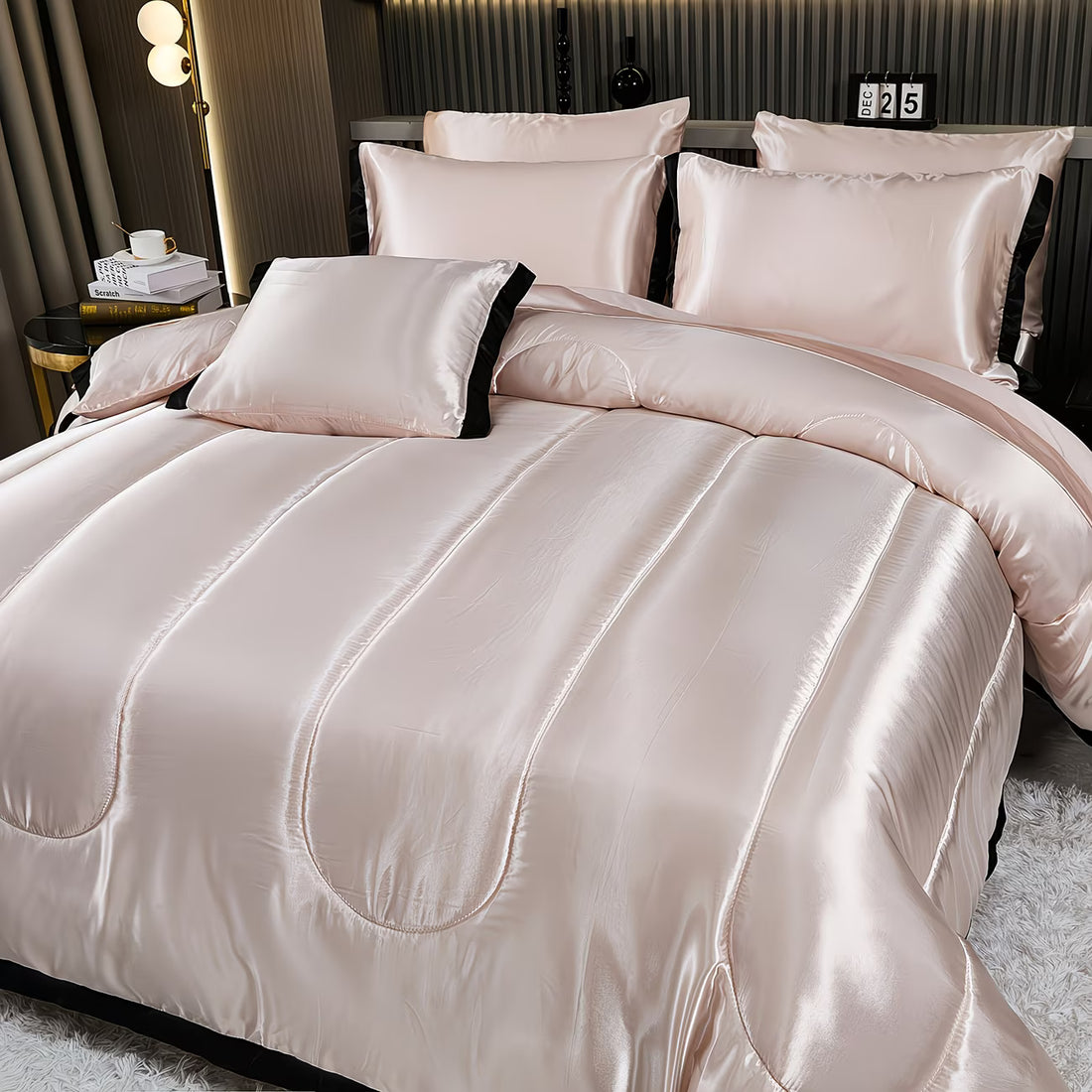 Neatly made bed with satin-like comforter and pillows in a bedroom setting.