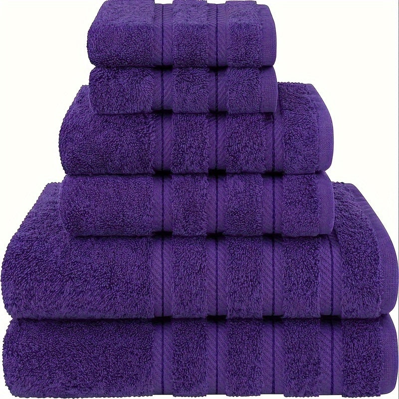 Stack of purple towels on a white background