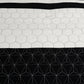 Hexagonal patterned fabric with white hexagons on a black background