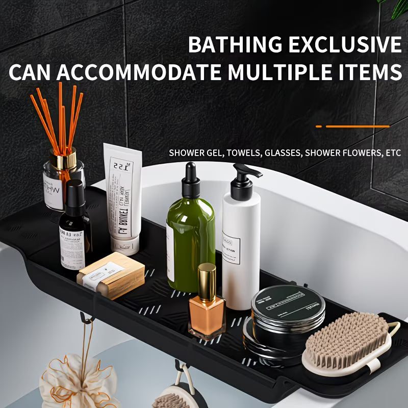 Bathing exclusive tray with various bathroom items on a black tray against a black tiled wall.